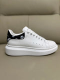 Alexander McQueen Men's Oversized Sneaker – Black with Skull Print Heel